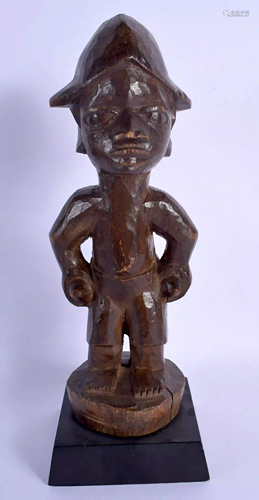 AN AFRICAN TRIBAL YORUBA HARDWOOD FIGURE. 29 cm high