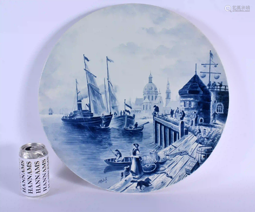 A VERY LARGE CONTINENTAL BLUE AND WHITE POTTERY CHARGER