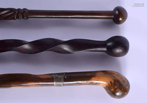 AN ANTIQUE WALKING CANE and two others. 95 cm long. (3)