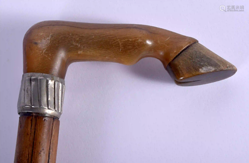 A 19TH CENTURY CARVED BUFFALO HORN HORSE HOOF WALK…