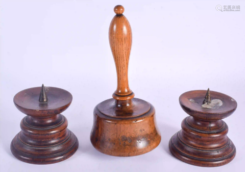 A PAIR OF ANTIQUE TREEN PRICKET CANDLESTICKS and a