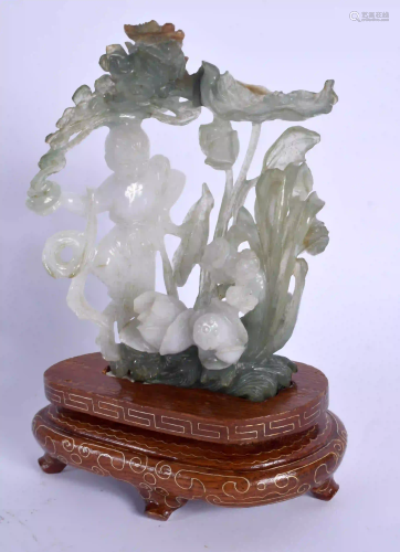 AN EARLY 20TH CENTURY CHINESE CARVED JADEITE FIGURE OF