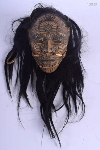 AN UNUSUAL TRIBAL CARVED AND LACQUERED HEAD OF A LEADER