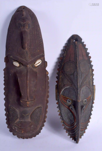 TWO PAPUA NEW GUINEA TRIBAL MASKS. Largest 47 cm x 16