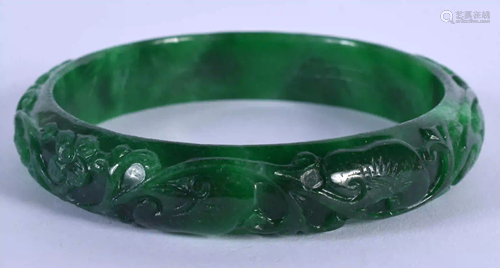 A CHINESE CARVED JADEITE BANGLE 20th Century. 7.5 cm