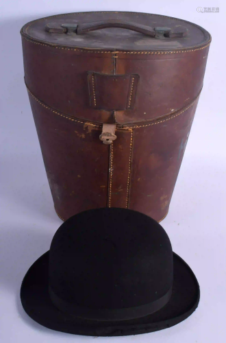 AN ANTIQUE LEATHER CASED WILSON BOWLER HAT. Hat