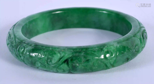 A CHINESE CARVED JADEITE BANGLE 20th Century. 7.5 cm