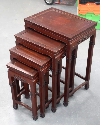 A NEST OF 19TH CENTURY CHINESE ROSEWOOD TABLES. Largest