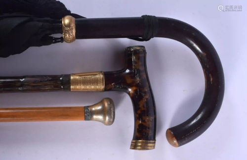 A VINTAGE TORTOISESHELL HANDLED CANE together with two
