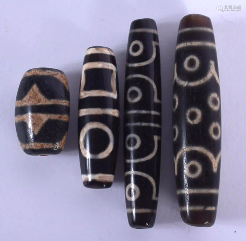 FOUR CHINESE TIBETAN AGATE BEADS 20th Century. Largest