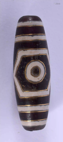 A CHINESE GOLD INLAID TIBETAN BEAD. 4 cm long.