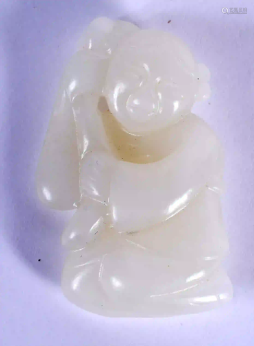 A CHINESE CARVED WHITE JADE FIGURE OF A BOY 20th