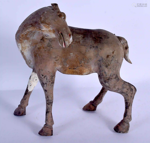 A CHINESE HAN DYNASTY POTTERY FIGURE OF A HORSE of