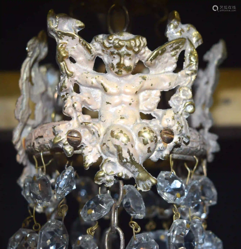 A 5 tier crystal glass chandelier with a cage of