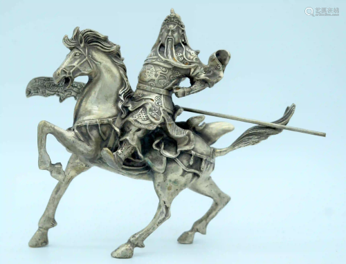 A white metal Guangon rider on a horse 18 x 23 cm.