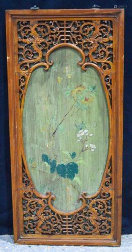 A Chinese framed lacquered panel decorated with foliage