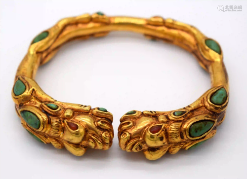 A Chinese yellow metal dragon bracelet inlaid with