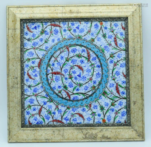 A framed Islamic tile 24 x 24 cm.
