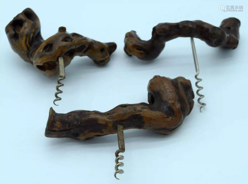 Three corkscrews with root wood handles. (3)