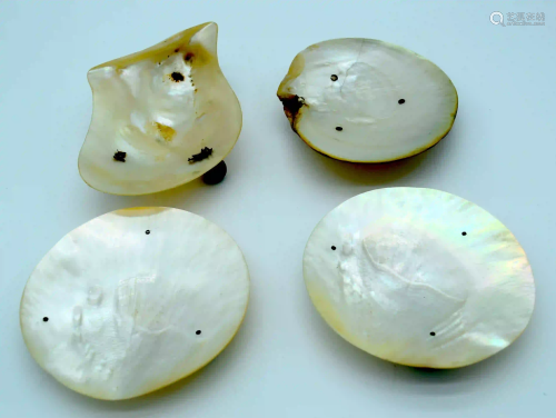 Four Mother of Pearl dishes Largest 18cm . (4)