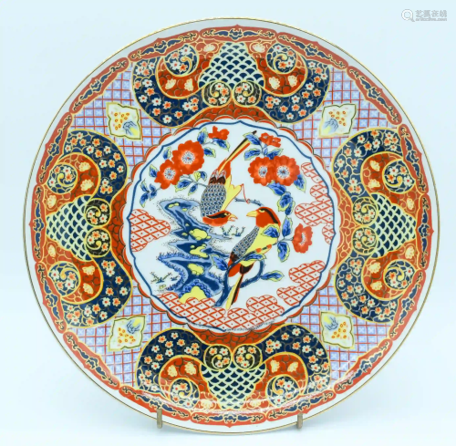 A large Japanese Imari platter depicting birds in a