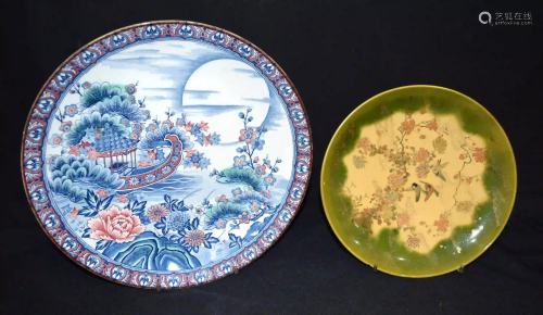 A large Japanese plate decorated with a boat and