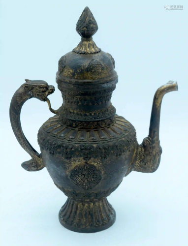 A bronze lidded dragon handled Tibetan oil ewer 38 x