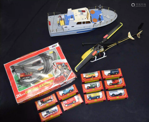A radio controlled helicopter and Boat together with
