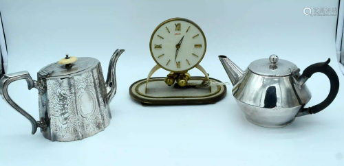 Two silver plate tea pots and a clock (3).