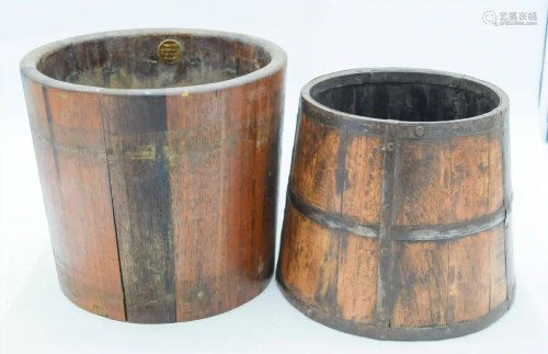 A 19th century metal banded oak barrel together with