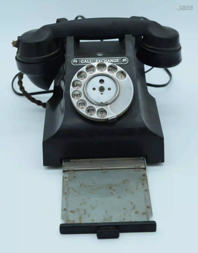 A vintage Bakelite telephone.