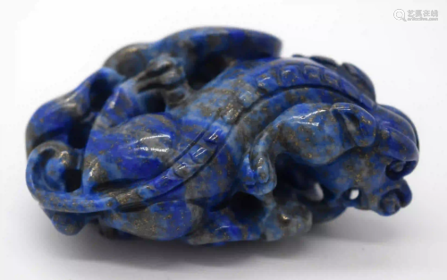 A carved Lapis Lazuli bolder in the form of a dragon