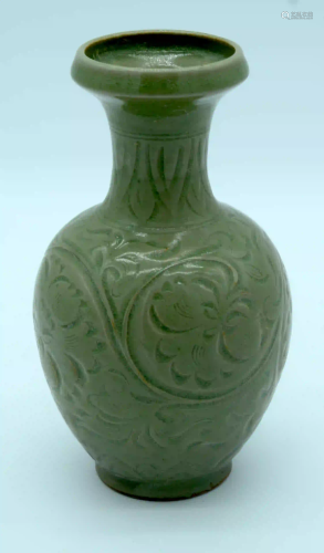 A Chinese green glazed vase with a floral pattern 24 x