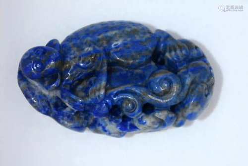 A carved Lapis Lazuli bolder in the form of a monkey