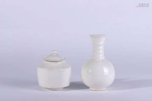 A Carved Ding Kiln Porcelain Covered Jar and a Vase