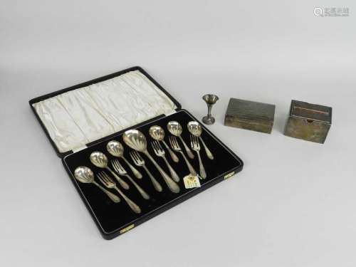 A cased set of silver spoons and forks