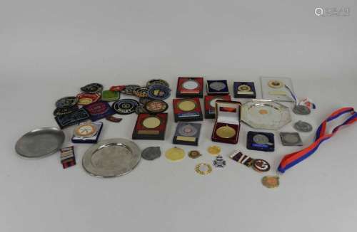 A large collection of metal and cloth shooting medals