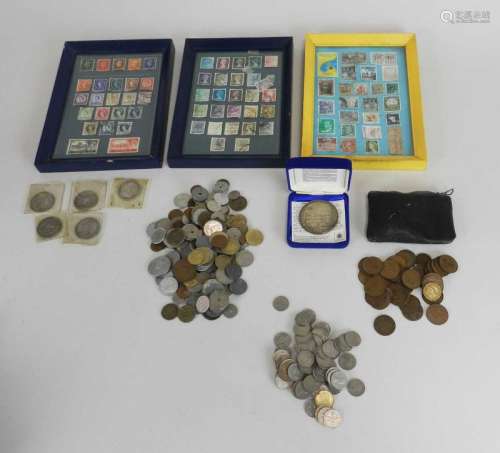 A collection of stamps and coins