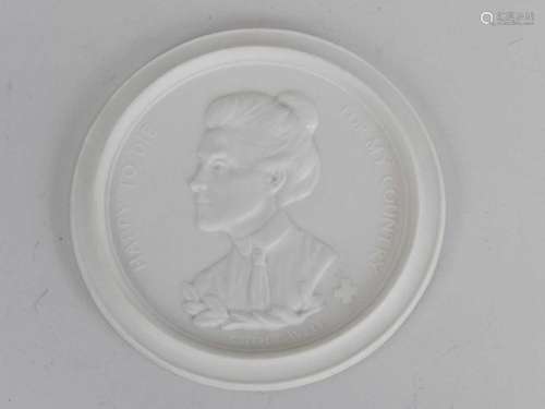 A Royal Worcester Bisque Porcelain Edith Cavell Commemorative Plaque, dated 1916, of circular form