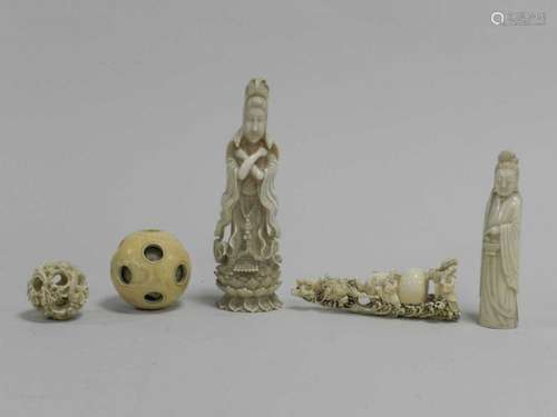 Two Chinese carved ivory figures, two puzzle balls, one lacking majority of concentric balls, a doub