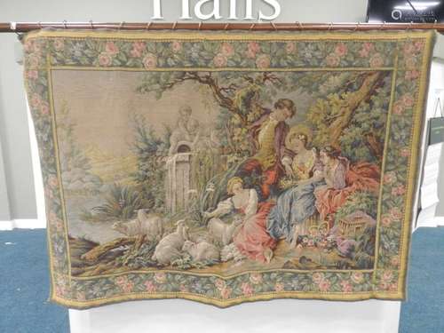 An 18th century style tapestry wall hanging, machine woven, worked with a scene of a rustic boy