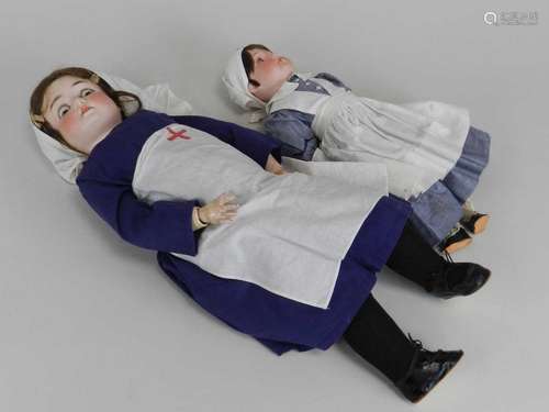 Two German porcelain-headed dolls in nurse uniform, the first Armand Marseille marked 390, the