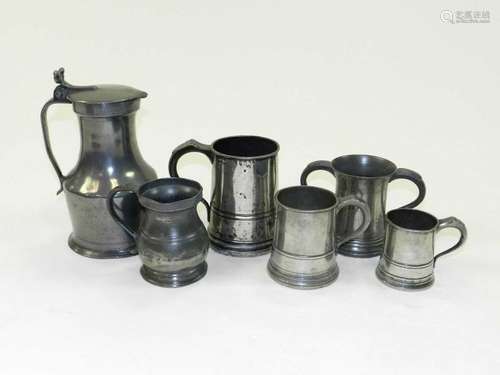 A Victorian pewter quart mug, a pewter pint mug, another 19th century ½ pint mug, another mug, a