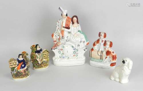 A group of Staffordshire earthenware figures19th century and latercomprising a flatback group of