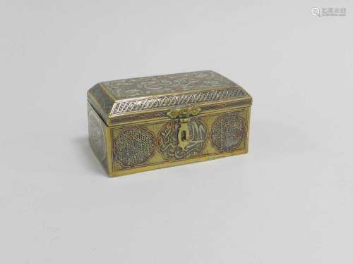 A near Eastern inlaid brass casket, circa 1900, with canted hinged top, inlaid in copper and white