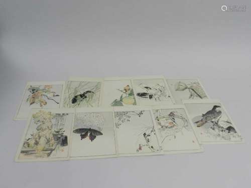 A collection of Japanese block prints to a volume, depicting flora and fauna with leaves of verse in