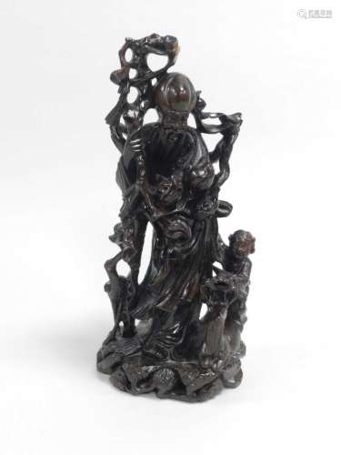 A Chinese carved and inlaid wooden figure of Shoulao
