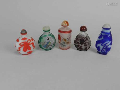 Five Chinese cameo glass snuff bottles, 20th century, including two with internally painted