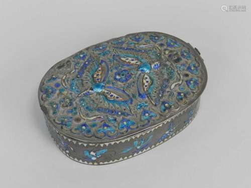 A Chinese enamelled silver makeup box, circa 1900, of ovoid form, the top and sides embossed and