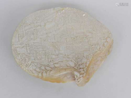 A Chinese carved mother of pearl shell, Qing Dynasty, 19th century, worked in relief with a scene of